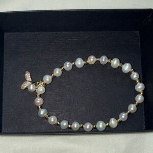 Elegant Pearl and Gold Butterfly Bracelet